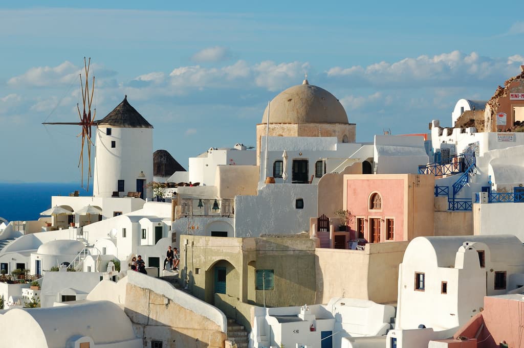 White-washed buildings and a windmill in Oia, Santorini